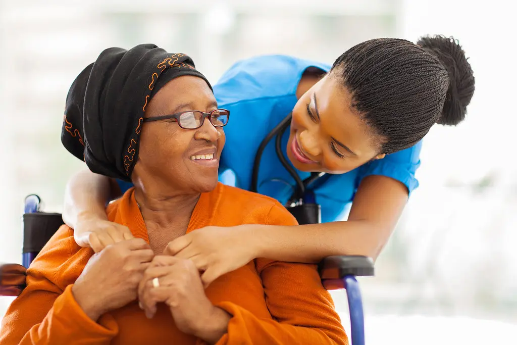 Physician speaking with a patient in a healthcare clinic